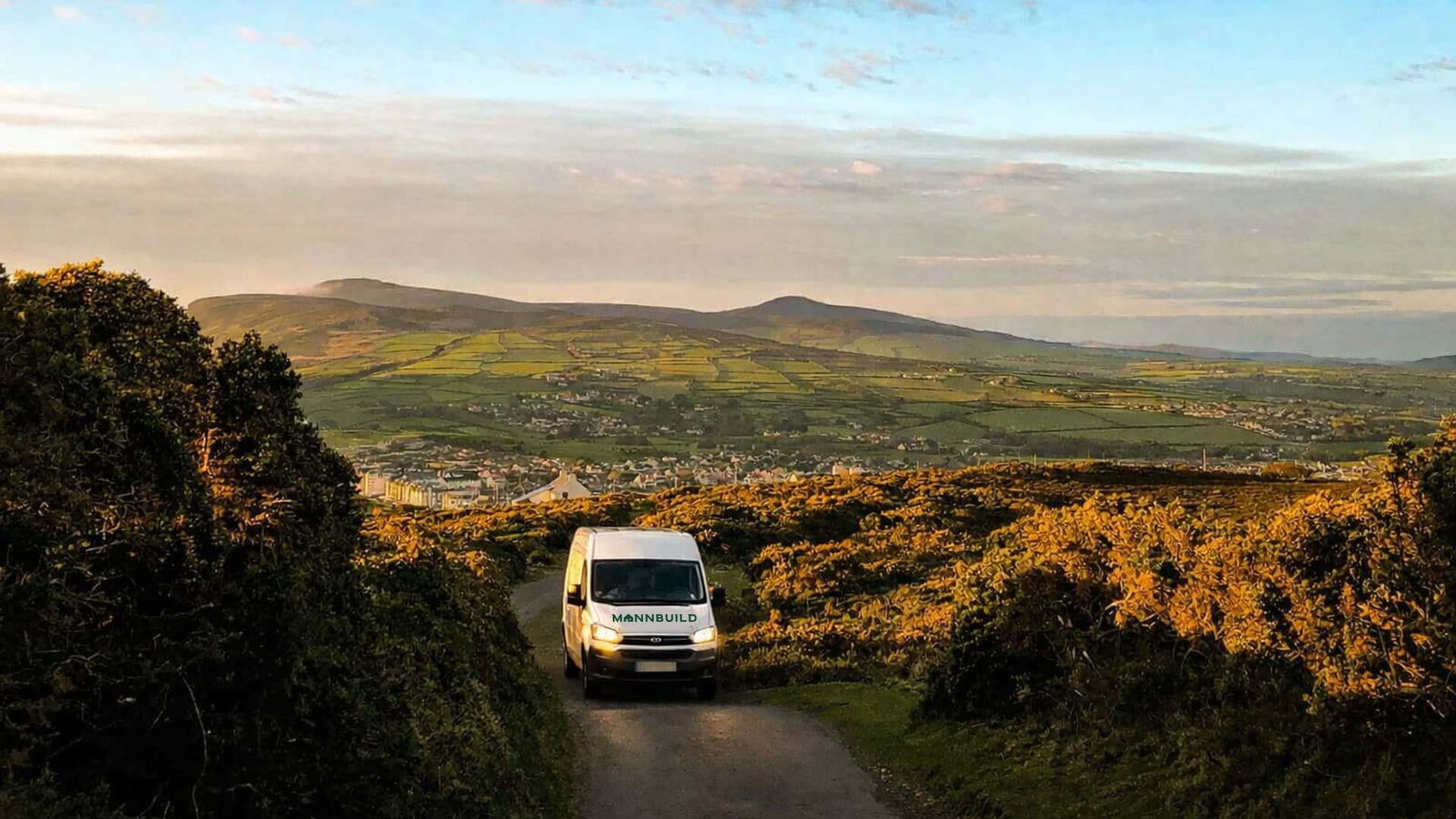 MannBuild construction van at Isle of Man building site - Professional construction services